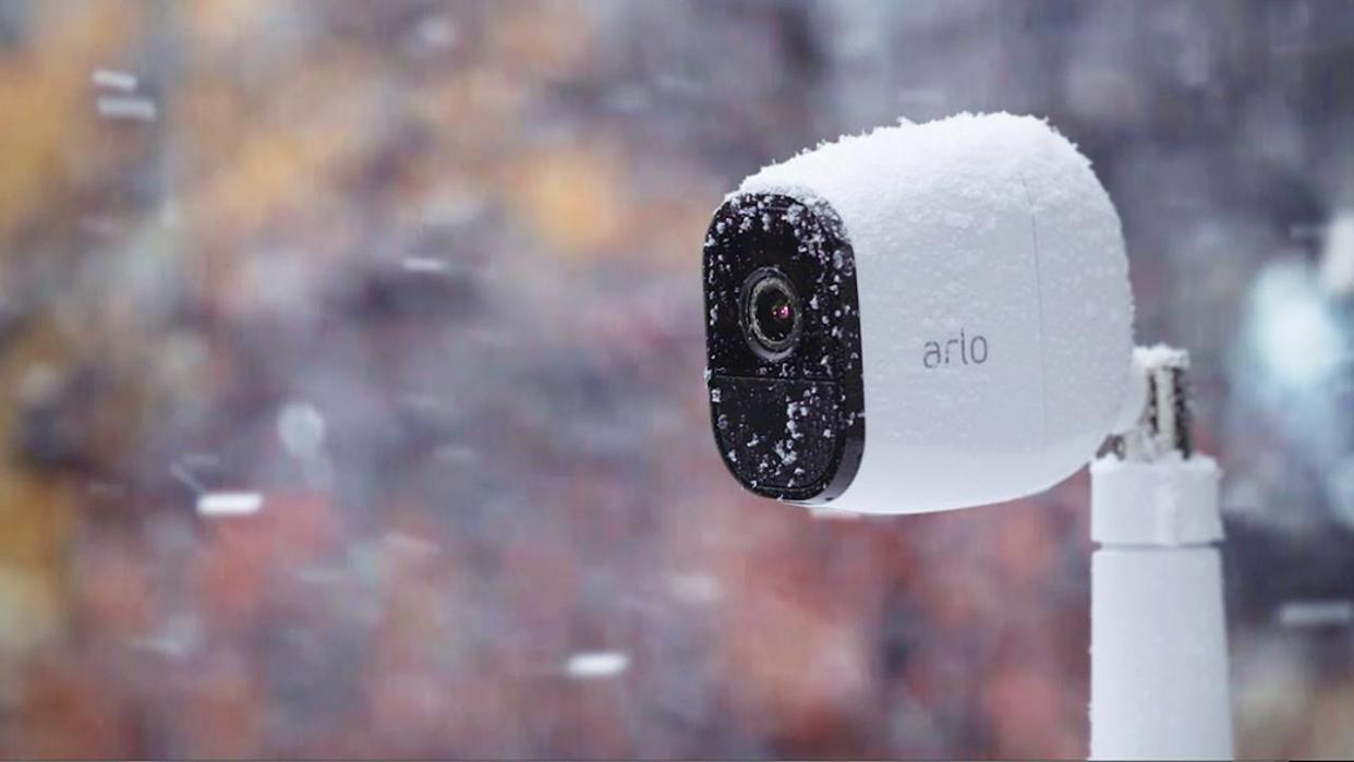  An Arlo outdoor security camera in the snow. 