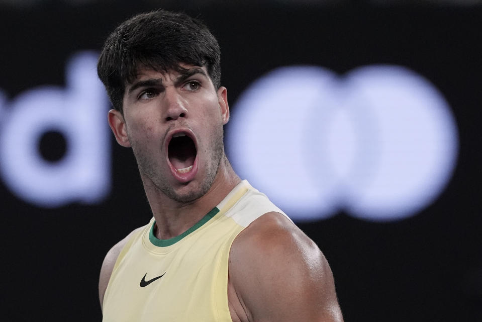 Carlos Alcaraz of Spain celebrates after defeating Miomir Kecmanovic of Serbia during their fourth round match at the Australian Open tennis championships at Melbourne Park, Melbourne, Australia, Monday, Jan. 22, 2024. (AP Photo/Andy Wong)