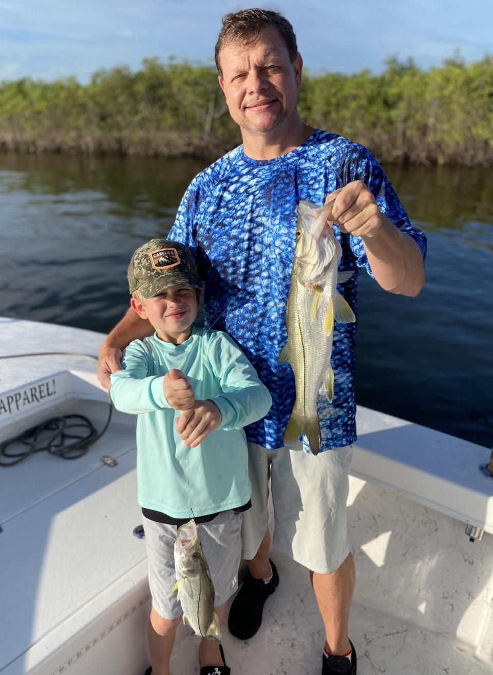 Tommy and Thomas Duncan, in town from Tallahassee, with a pair of catch-and-release snook caught aboard Capt. Jeff Patterson's Pole Dancer.