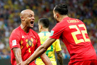 <p>Vincent Kompany celebrates after he and Nacer Chadli combined to put Belgium ahead, through an own goal by Fernandinho </p>