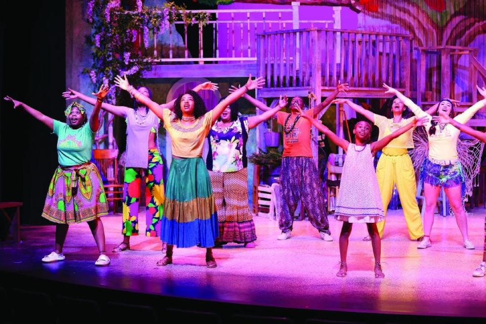Young people and adults onstage at the South Carolina Children's Theatre during a performance of "Once On This Island," which runs through May 21. The production wraps up the season before summer camps start.