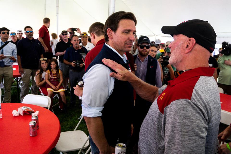 Florida Gov. Ron DeSantis talks with supporters at an Iowa State Wrestling tailgate before the Cy-Hawk football game at Jack Trice Stadium on Saturday, September 9, 2023 in Ames.