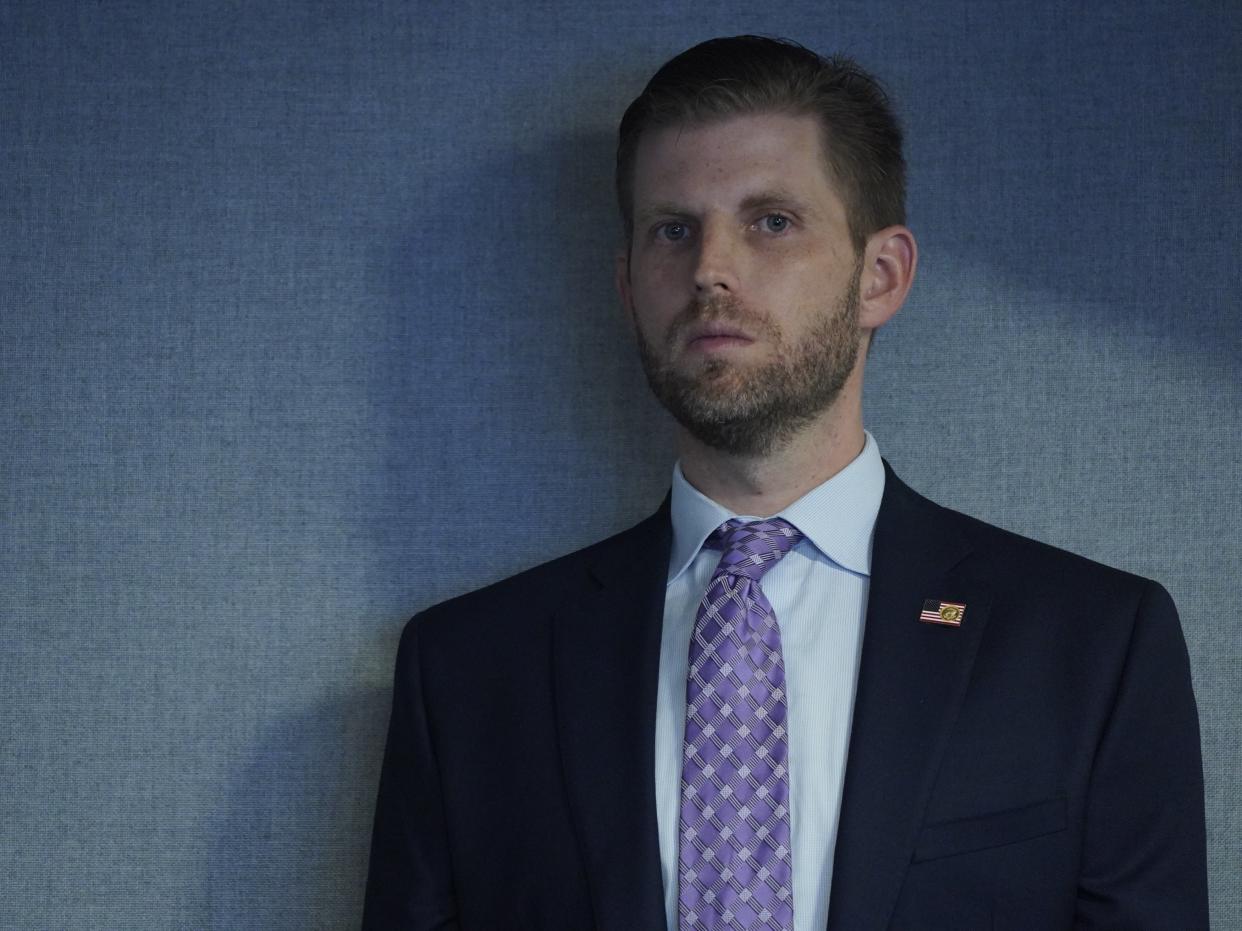 Eric Trump looks on as US President Donald J. Trump attends a briefing on Hurricane Laura in the Federal Emergency Management Agency (FEMA) headquarters, in Washington, DC, USA, 27 August 2020 (EPA)