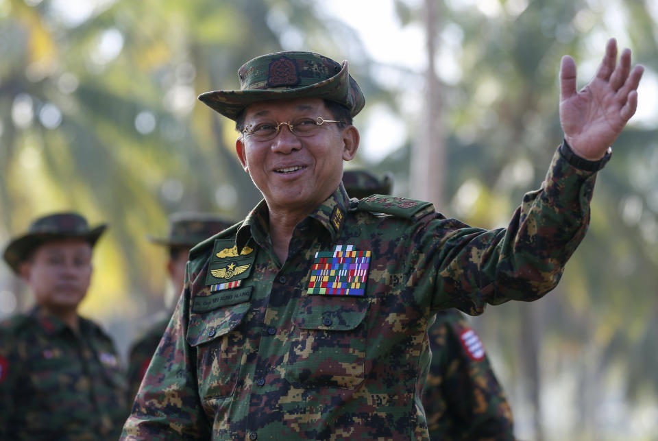 Myanmar military commander-in-chief Senior General Min Aung Hlaing gestures as he arrives to attend the second day of 'Sin Phyu Shin' joint military exercises, Saturday, Feb. 3, 2018, in Ayeyarwaddy delta region, Myanmar. The two-day military exercise is the biggest since 1997, involving several different armed forces. (Lynn Bo Bo/Pool Photo via AP)