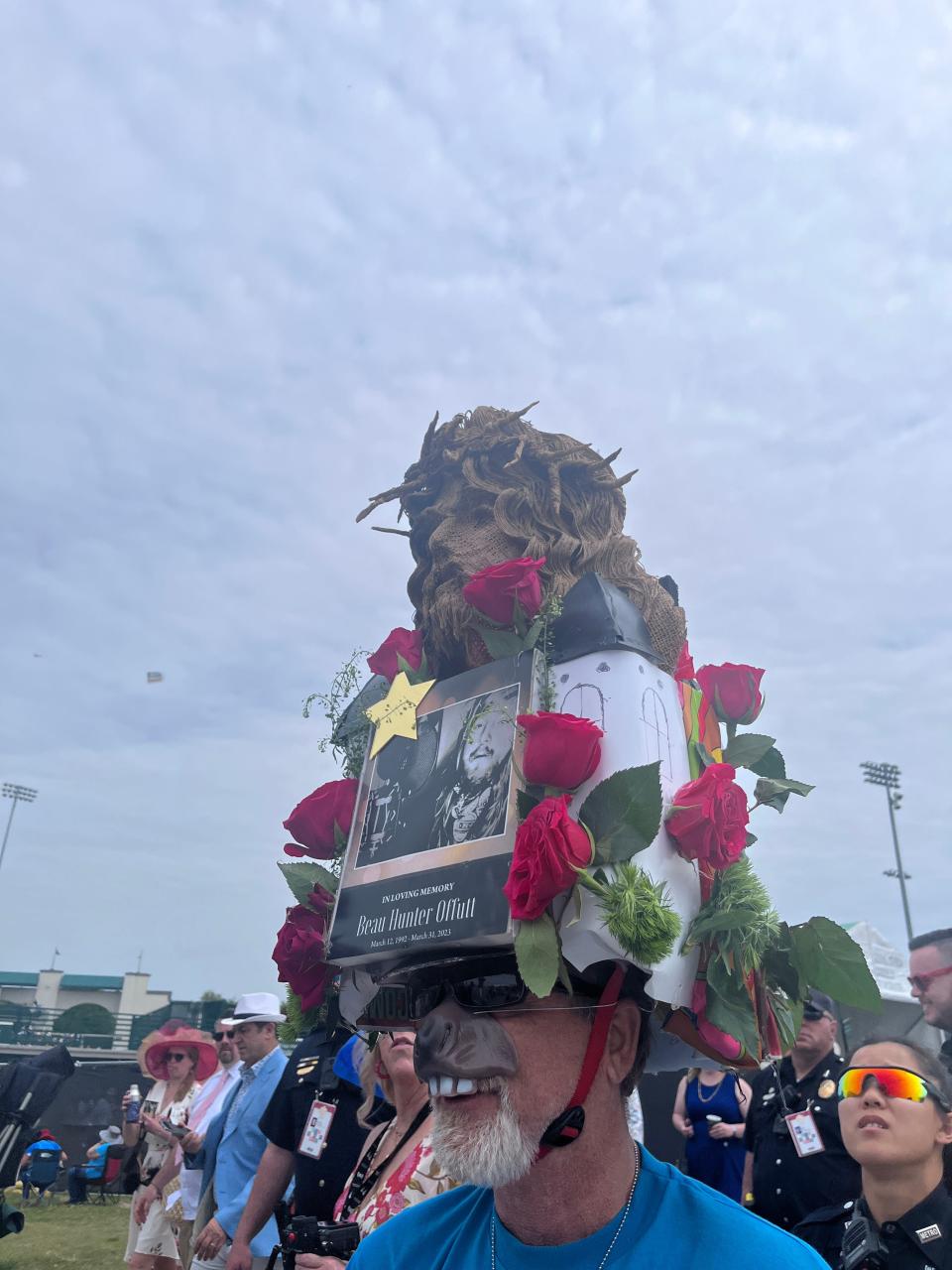 Tony Offutt wears a hat that displays a photo of his son, Beau, who died by suicide in March, while at the Kentucky Derby on Saturday, May 6, 2023.