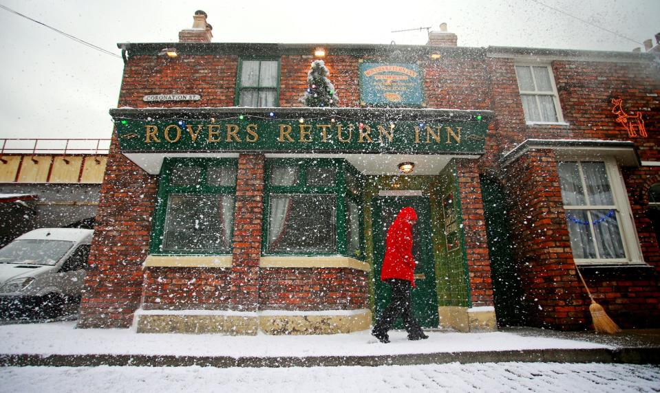 The Rovers Return Inn on the Coronation Street film-set located in fictional Weatherfield, Salford, Manchester, where it has been decked inside and out for Christmas with false snow and decorations.