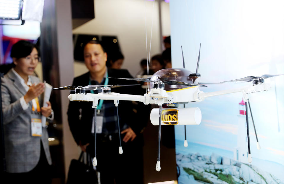 SHANGHAI, Nov. 8, 2018 -- A staff member of UPS introduces drone delivery at the Trade in Services area of the first China International Import Expo in Shanghai, east China, Nov. 8, 2018.  (Xinhua/Fang Zhe) (Xinhua/Fang Zhe via Getty Images)