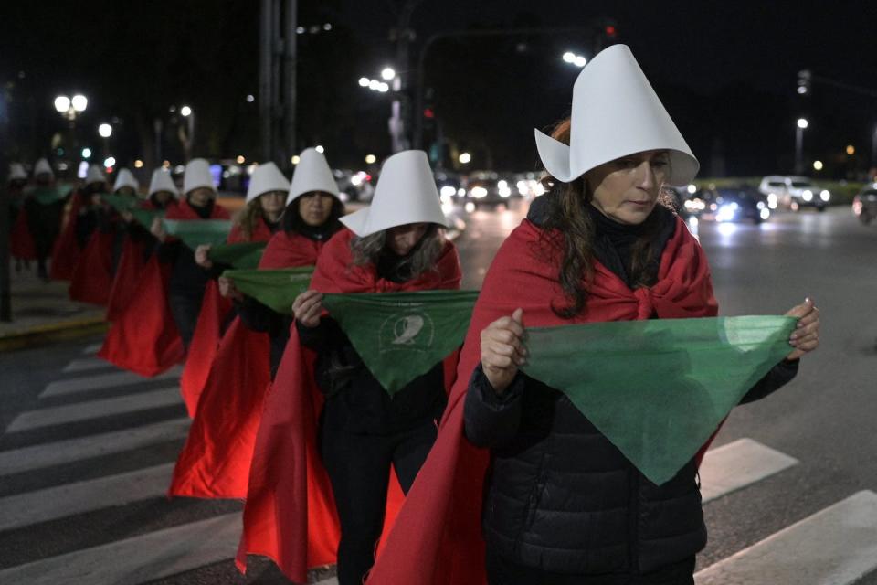 Pro-abortion rights activists protest the Dobbs v. Jackson Women’s Health Organization decision in Buenos Aires on June 30, 2022. <a href="https://media.gettyimages.com/photos/prochoice-activists-disguised-as-characters-from-canadian-author-picture-id1241635310?s=2048x2048" rel="nofollow noopener" target="_blank" data-ylk="slk:Juan Mabromata/AFP via Getty Images;elm:context_link;itc:0;sec:content-canvas" class="link ">Juan Mabromata/AFP via Getty Images</a>