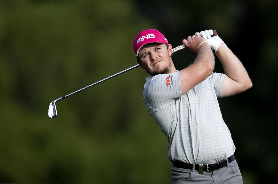 England's Eddie Pepperell follows his ball on the 18th hole during the third round of the Dubai Desert Classic golf tournament in Dubai, United Arab Emirates, Saturday, Jan. 25, 2020. (AP Photo/Kamran Jebreili)