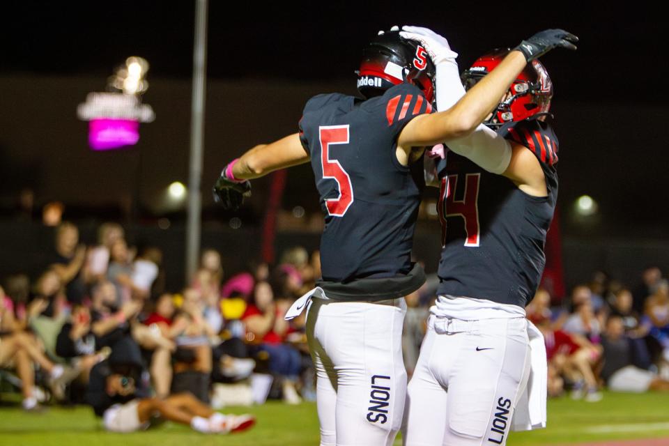 Ryan Jezioro, No. 5 celebrates his touchdown with Braylon Gardner, No. 14 at Liberty High School football field in Peoria on Oct. 20, 2023.