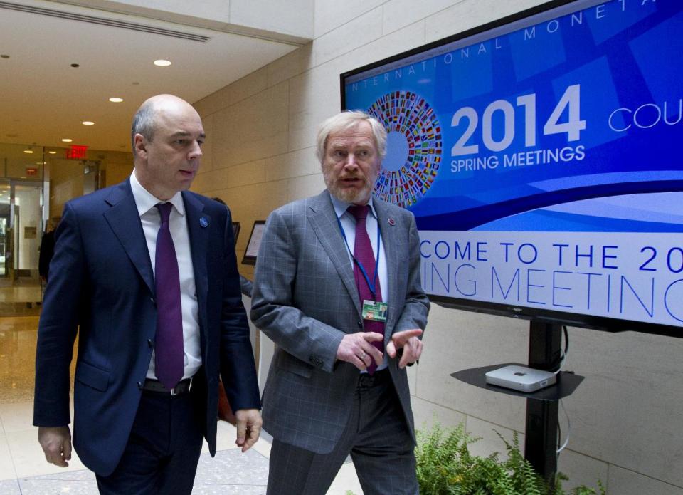 Russian Finance Minister Anton Siluanov, left, and Russian Deputy Finance Minister Sergei Storchak walk to the G20 finance ministers and central bank governors meeting on the sidelines of their meeting at World Bank Group-International Monetary Fund Spring Meetings in Washington, Friday, April 11, 2014. ( AP Photo/Jose Luis Magana)
