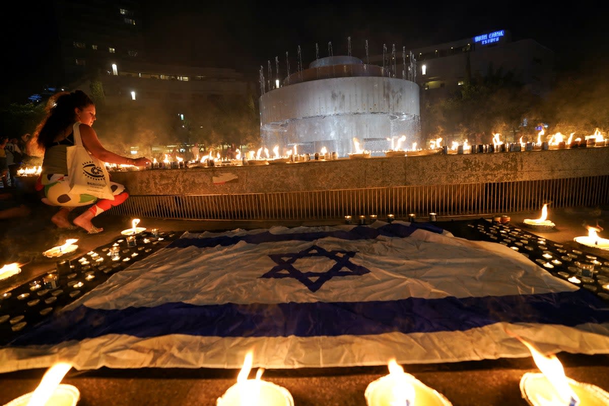 People gather and light candles to show solidarity with Israel and remember the victims following an attack by Hamas gunmen from Gaza, at Dizengoff square in Tel Aviv (REUTERS)