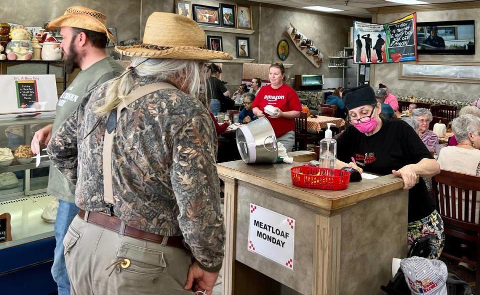 A customer waits to check out Nov. 20, 2021 at Ginger Brown’s Old Tyme Restaurant.