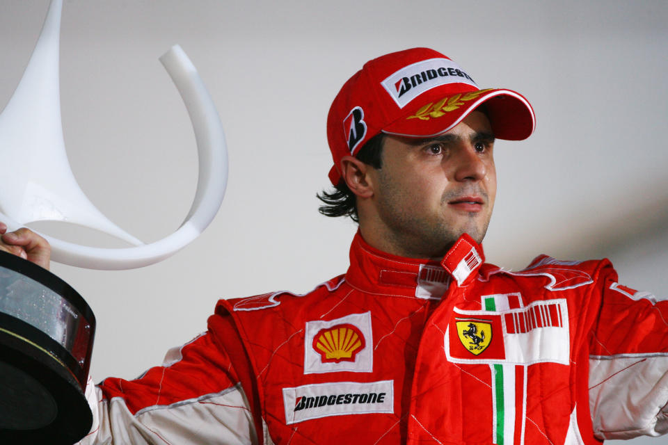 SAO PAULO, BRAZIL - NOVEMBER 02:  Felipe Massa of Brazil and Ferrari looks disappointed on the podium after winning the race but losing the World Championship at the Brazilian Formula One Grand Prix at the Interlagos Circuit on November 2, 2008 in Sao Paulo, Brazil.  (Photo by Ker Robertson/Getty Images)