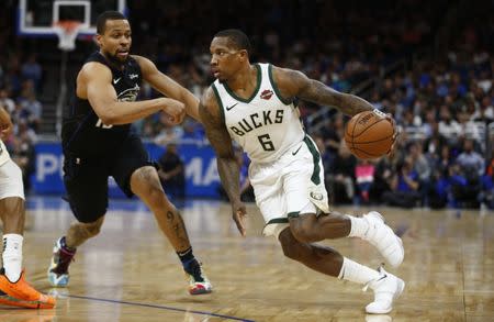 Jan 19, 2019; Orlando, FL, USA; Milwaukee Bucks guard Eric Bledsoe (6) drives past Orlando Magic guard Isaiah Briscoe (13) during the second half at Amway Center. Mandatory Credit: Reinhold Matay-USA TODAY Sports