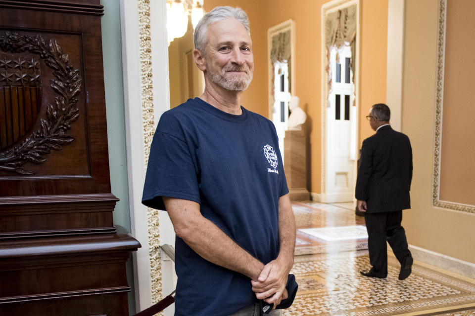 Jon Stewart, former host of The Daily Show, smiles at the Ohio Clock Corridor in the Capitol on Tuesday, July 23, 2019. The Senate will be voting later today on HR 1327: Never Forget the Heroes: Permanent Authorization of the September 11th Victim Compensation Fund Act. (Photo: Bill Clark/CQ Roll Call/Getty Images)