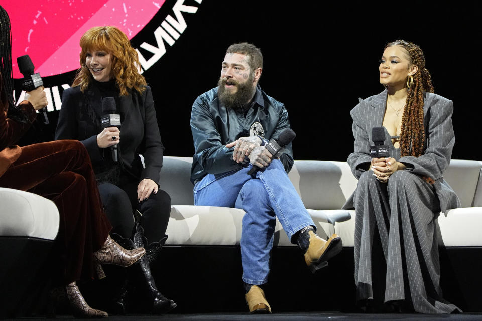 From left, Reba McEntire, Post Malone and Andra Day attend a news conference ahead of the Super Bowl 58 NFL football game Thursday, Feb. 8, 2024, in Las Vegas. (AP Photo/John Locher)