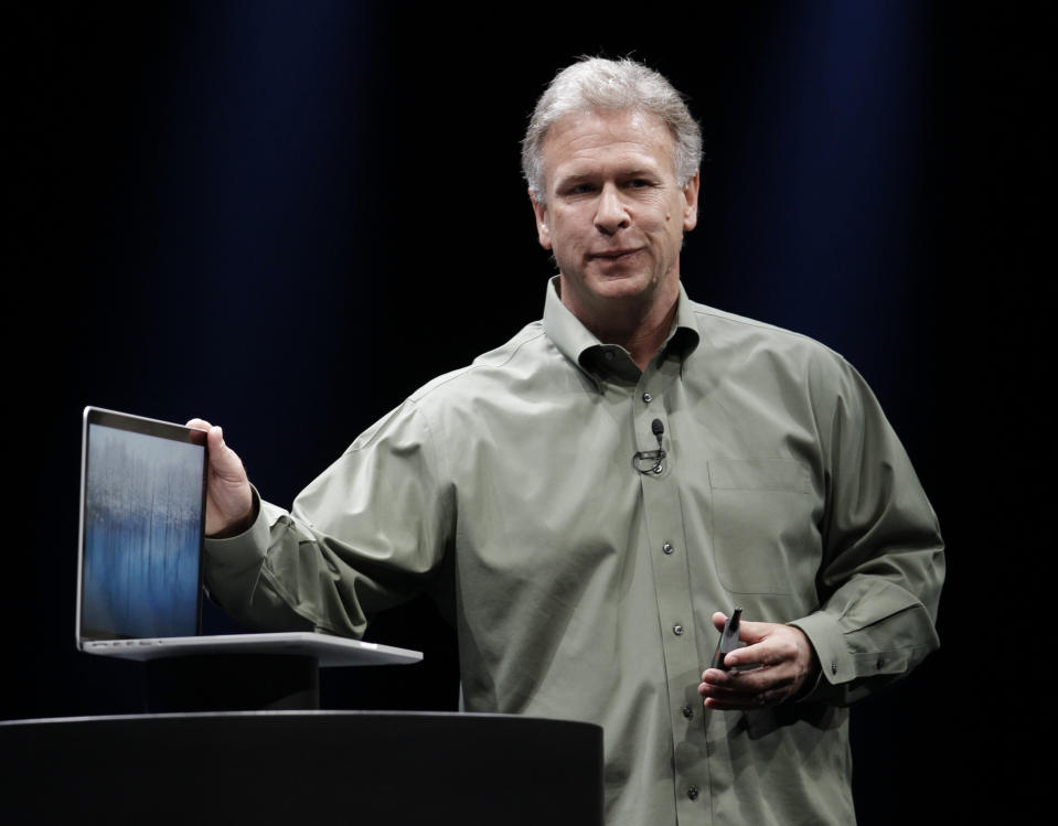 Apple's Phil Schiller speaks about the new MacBook Pro at the Apple Developers Conference in San Francisco, Monday, June 11, 2012. The MacBook Pro, will get a new Intel chip and prices for the 13-inch model will be $1,199 to $1,499, while a 15-inch model will be $1,799 or $2,199, depending on the amount of storage. The new MacBook Air and MacBook Pro models will start shipping Monday. (AP Photo/Paul Sakuma)