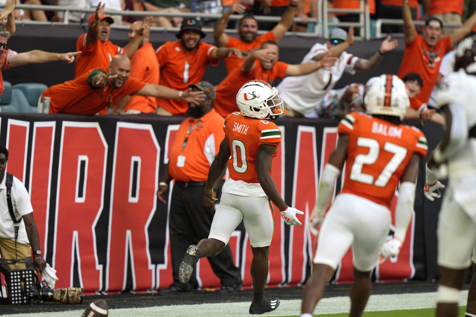Fans react after Miami wide receiver Brashard Smith (0) scores a touchdown during the second half of an NCAA college football game Saturday against Texas A&M, Sept. 9, 2023, in Miami Gardens, Fla. (AP Photo/Lynne Sladky)