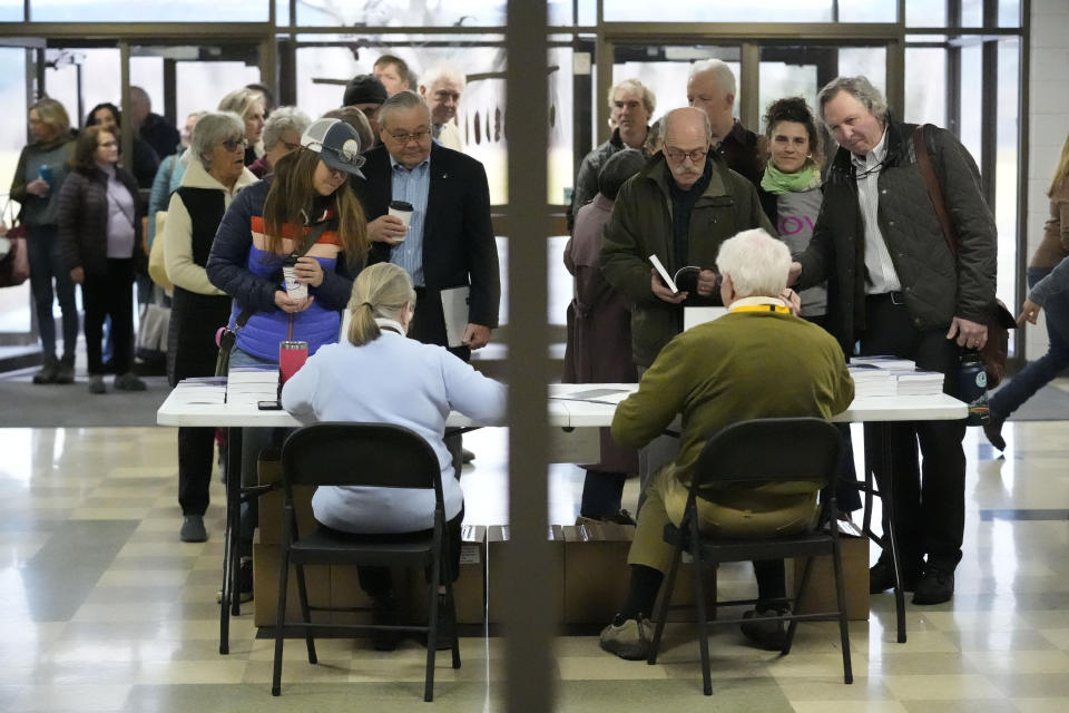 A overflow crowd signs in before attending a town meeting and voting in the primary election, Tuesday, March 5, 2024, in Stowe, Vt. Super Tuesday elections are being held in 16 states and one territory. Hundreds of delegates are at stake, the biggest haul for either party on a single day. Super Tuesday elections are being held in 16 states and one territory. Hundreds of delegates are at stake, the biggest haul for either party on a single day. (AP Photo/Robert F. Bukaty)