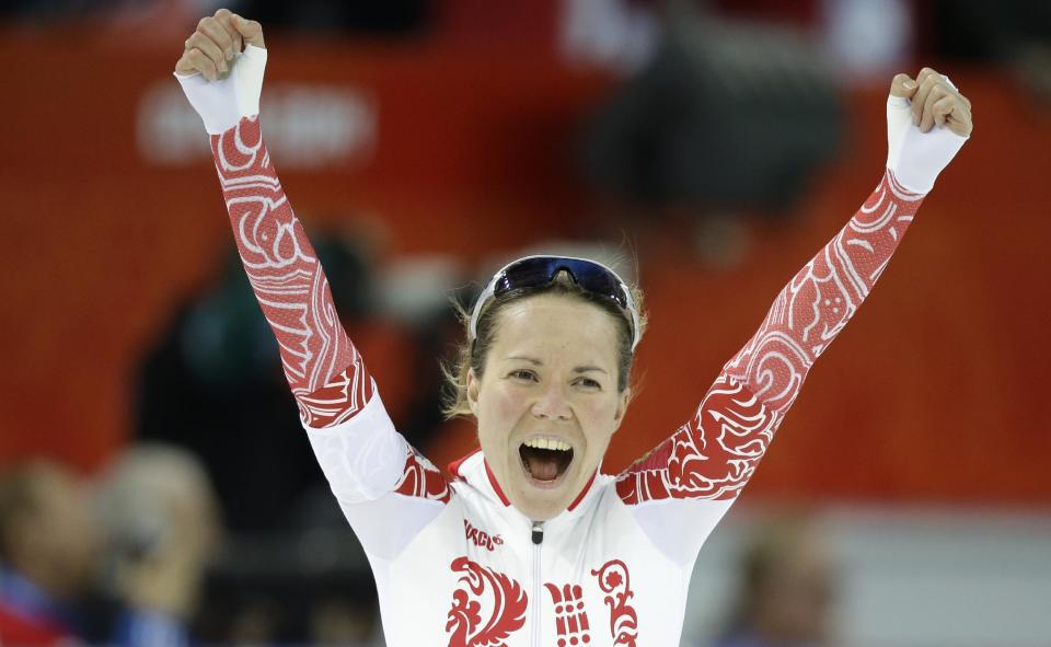 Russia's Olga Graf celebrates her time after competing in the women's 3,000-meter speedskating race at the Adler Arena Skating Center during the 2014 Winter Olympics, Sunday, Feb. 9, 2014, in Sochi, Russia. (AP Photo/Patrick Semansky)