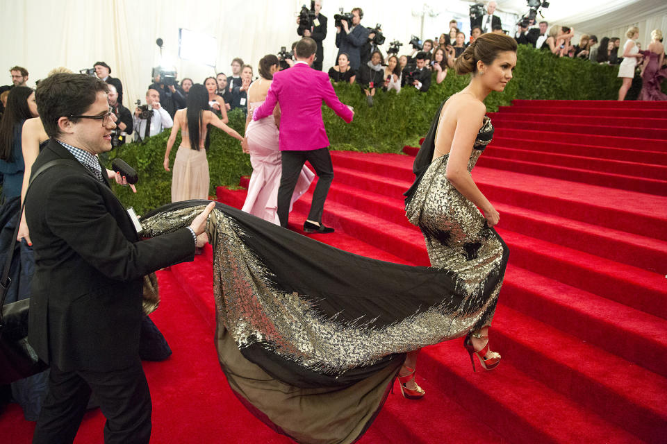 Nina Dobrev arrives at the Metropolitan Museum of Art Costume Institute gala benefit, celebrating Elsa Schiaparelli and Miuccia Prada, Monday, May 7, 2012 in New York. (AP Photo/Charles Sykes)