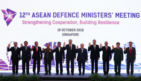 ASEAN defence ministers pose for a group photo at the ASEAN Defence Ministers' Meeting in Singapore October 19, 2018. REUTERS/Edgar Su