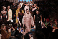 Models wear creations as part of the Fendi Fall/Winter 2020 collection, presented in Milan, Italy, Thursday, Feb. 20, 2020. (AP Photo/Antonio Calanni)