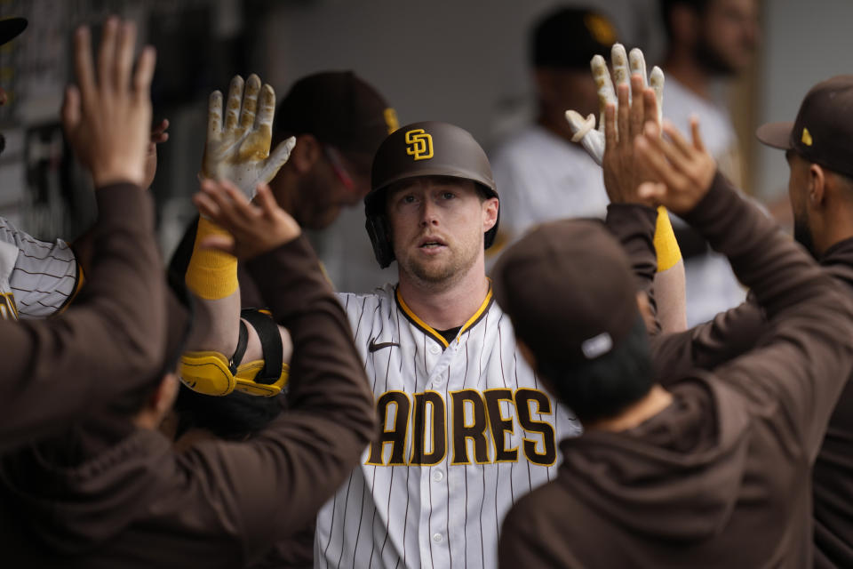 San Diego Padres' Jake Cronenworth celebrates with teammates after hitting a home run during the fifth inning of a baseball game against the Kansas City Royals, Wednesday, May 17, 2023, in San Diego. (AP Photo/Gregory Bull)