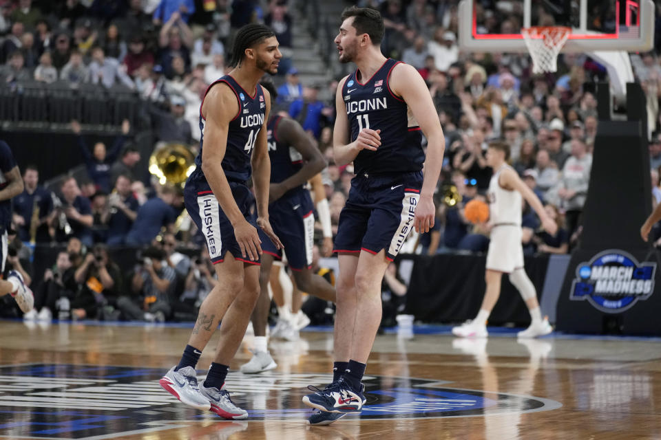 UConn forward Alex Karaban, right, celebrates with guard Andre Jackson Jr. after hitting a three-point basket in the first half of an Elite 8 college basketball game in the West Region final of the NCAA Tournament, Saturday, March 25, 2023, in Las Vegas. (AP Photo/John Locher)