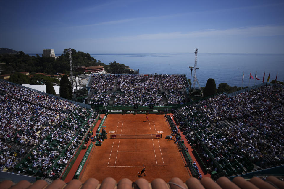 Jannik Sinner, of Italy returns the ball to Stefanos Tsitsipas, of Greece during their Monte Carlo Tennis Masters semifinal match in Monaco, Saturday, April 13, 2024. (AP Photo/Daniel Cole)