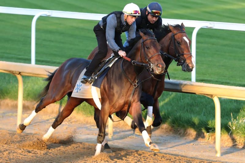 Kentucky Derby contender Honor Marie (outside) works out at Churchill Downs. Photo courtesy of Churchill Downs