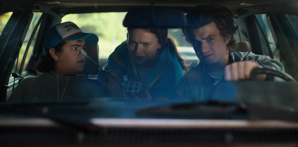 Steve, Dustin, and Max in a car