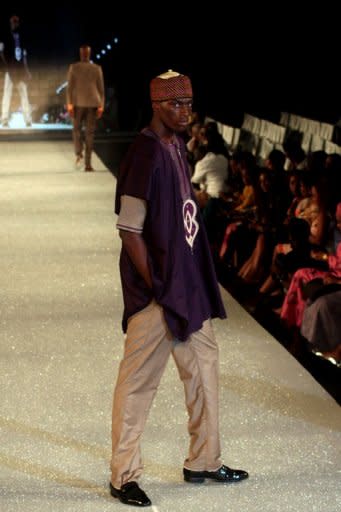 A model presents clothes from The Collection of Kola kuddus at The Arise Magazine Fashion Week at Victoria Island in Lagos, last month