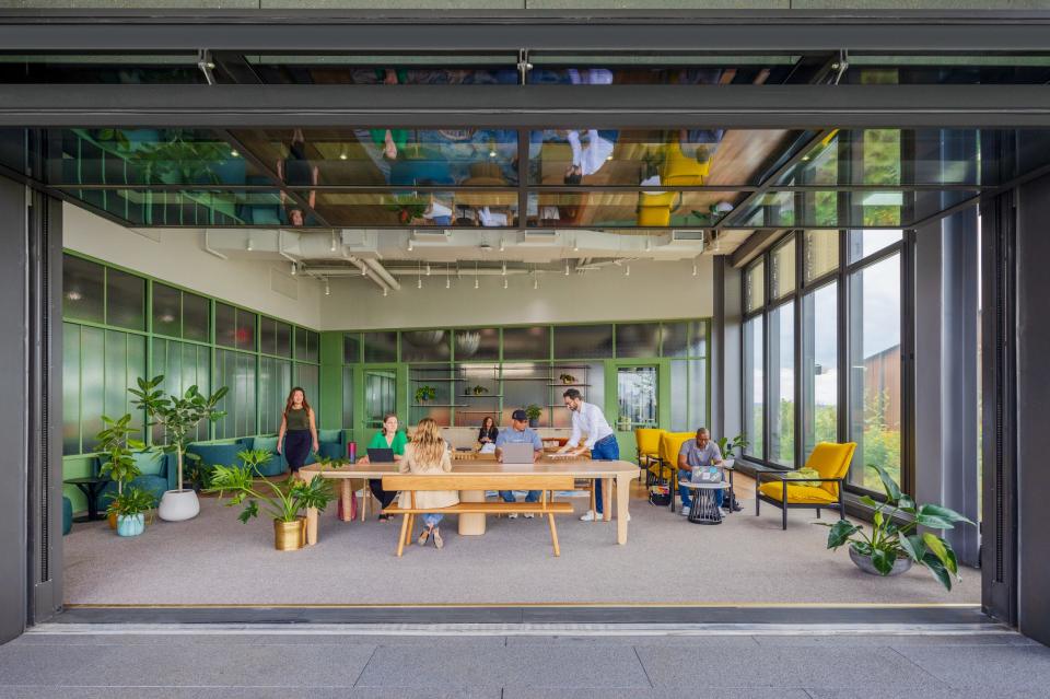 An indoor space with wooden benches 