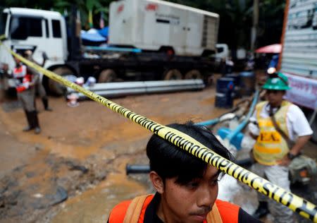 Soldiers and rescue workers work near Tham Luang cave complex, as an ongoing search for members of an under-16 soccer team and their coach continues, in the northern province of Chiang Rai, Thailand, July 2, 2018. REUTERS/Soe Zeya Tun