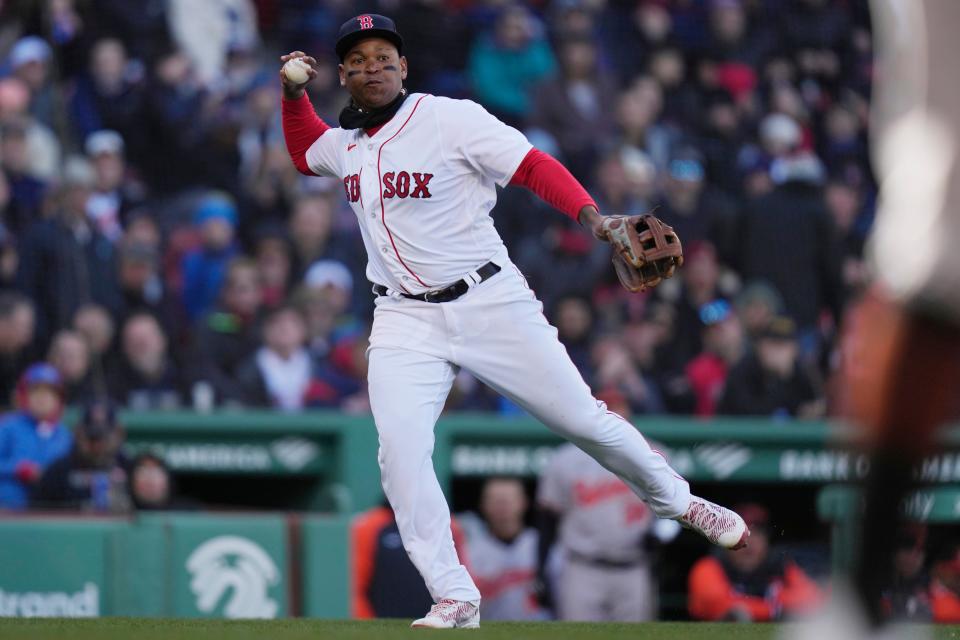 Boston Red Sox third baseman Rafael Devers makes a play during Thursday's opener against Baltimore.