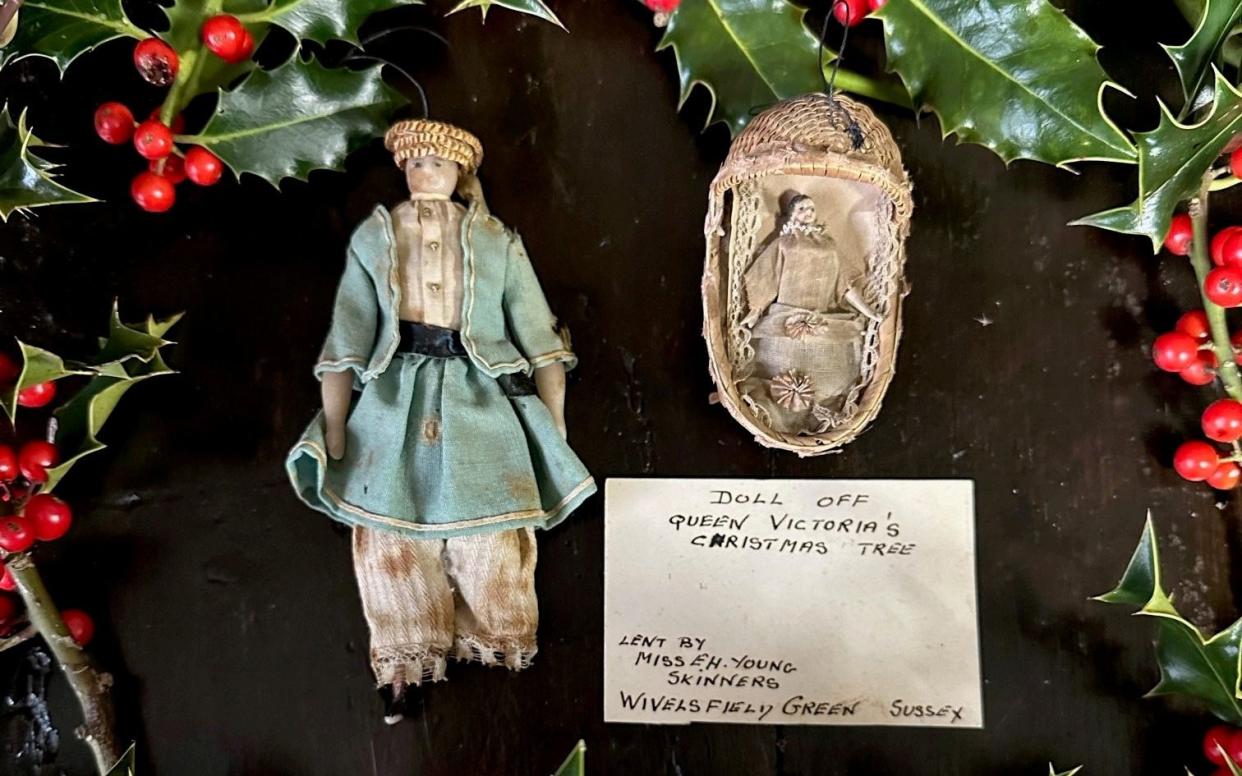 The former Queen's ornaments, a small doll inside a woven crib and and a wax doll, are more than 100 years old