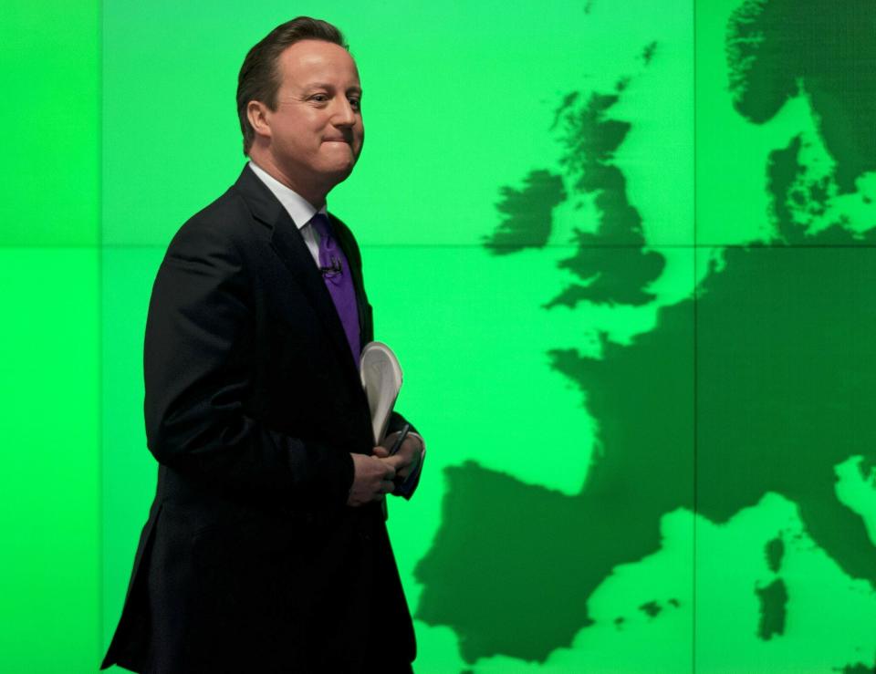 FILE - Britain's Prime Minister David Cameron walks past a map of Europe on a screen as he walks away after making a speech on holding a referendum on staying in the European Union in London, Jan. 23, 2013. The U.K. election in December 2019 was basically about one issue: Brexit. General elections in the U.K. are typically held in the spring or early summer. But in the fall of 2019, the recently-appointed Prime Minister Boris Johnson gambled on holding one on December 12, when most people just want to get ready for Christmas and would rather think of anything but politics. (AP Photo/Matt Dunham, File)