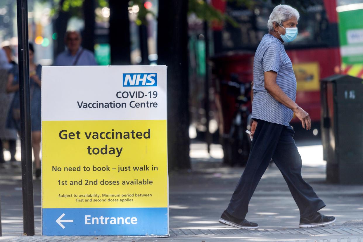 A man walks past an NHS Covid-19 vaccination centre in London, Britain, on Sept. 7, 2021. Britain has recorded more than 7 million COVID-19 cases since the start of the pandemic, according to the latest official data released on Monday.   The country reported another 41,192 coronavirus cases in the latest 24-hour period, bringing the total number of coronavirus cases in the country to 7,018,921, official figures showed. (Photo by Ray Tang/Xinhua via Getty Images)