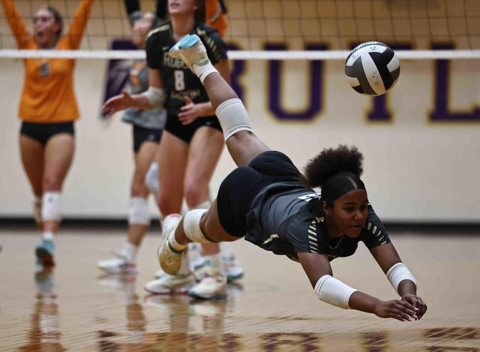 Roger Bacon's Mariah Gaines (10) dives for the ball during their Division II regional semifinal against Mercy McAuley Thursday, Nov. 3, 2022, at Butler High School.