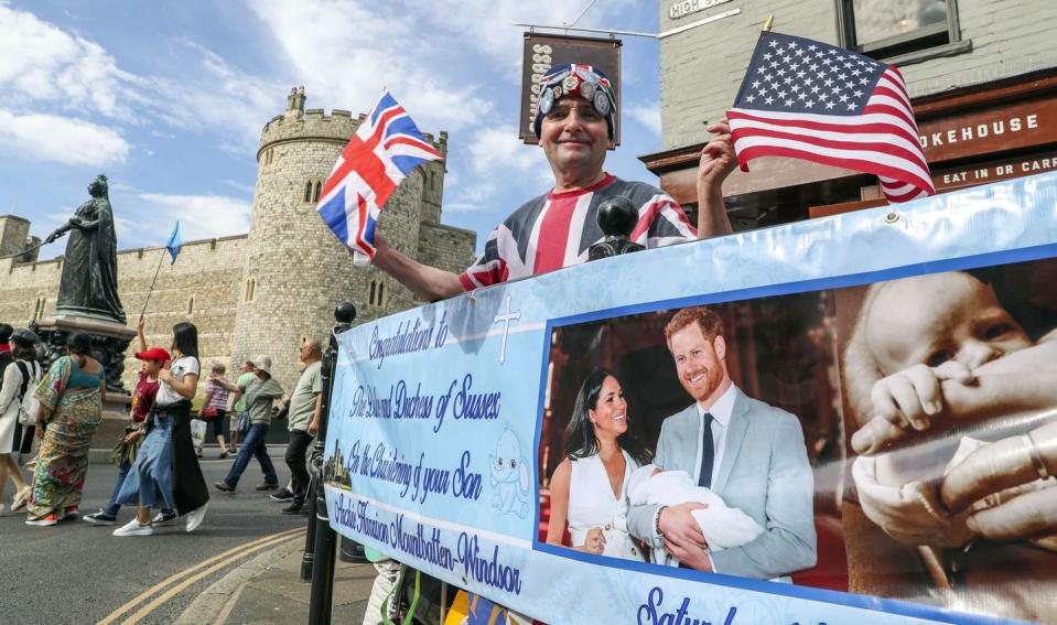 A Sussex mega fan celebrates Archie's christening from outside Windsor Castle.