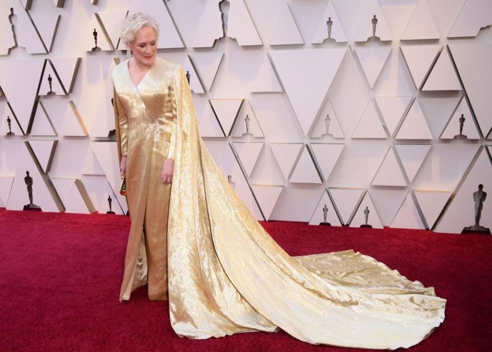 Glenn Close in a gold caped gown