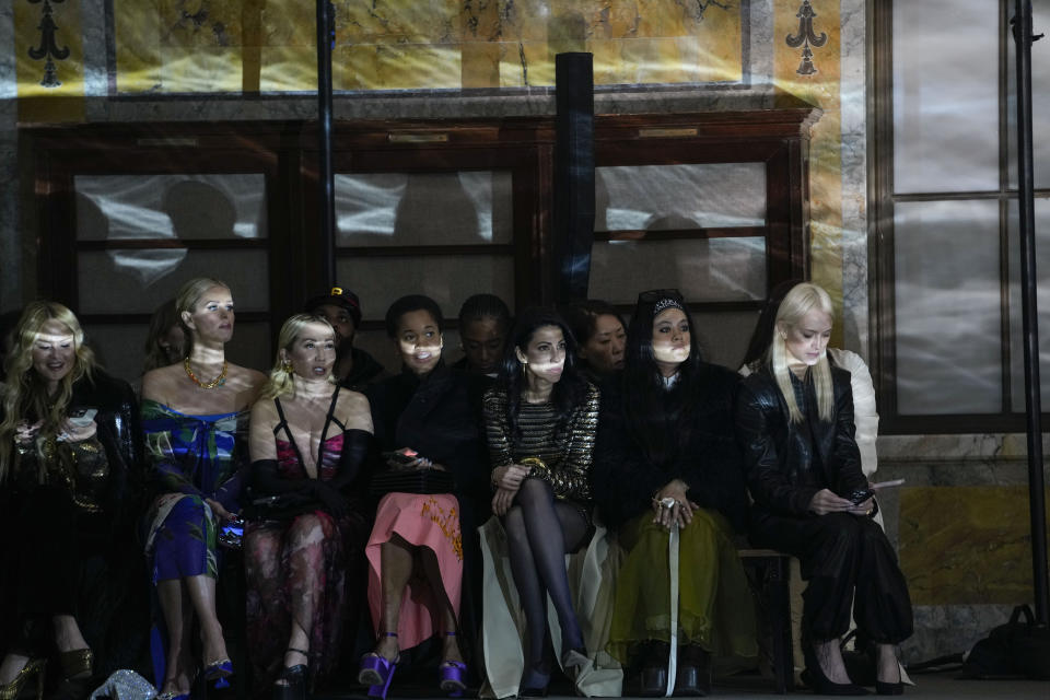 Huma Abedin, third from right, watches as the Prabal Gurung collection is modeled during Fashion Week, Friday, Feb. 10, 2023, in New York. (AP Photo/Mary Altaffer)