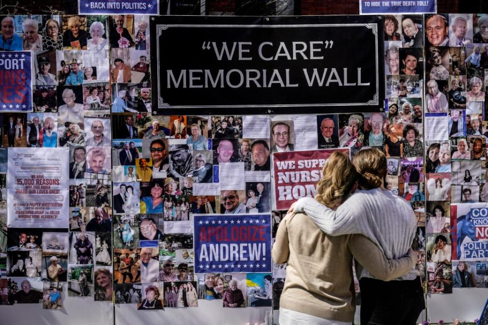 A protest-memorial wall for nursing home residents who died from COVID-19 urges Cuomo to take responsibility. AP