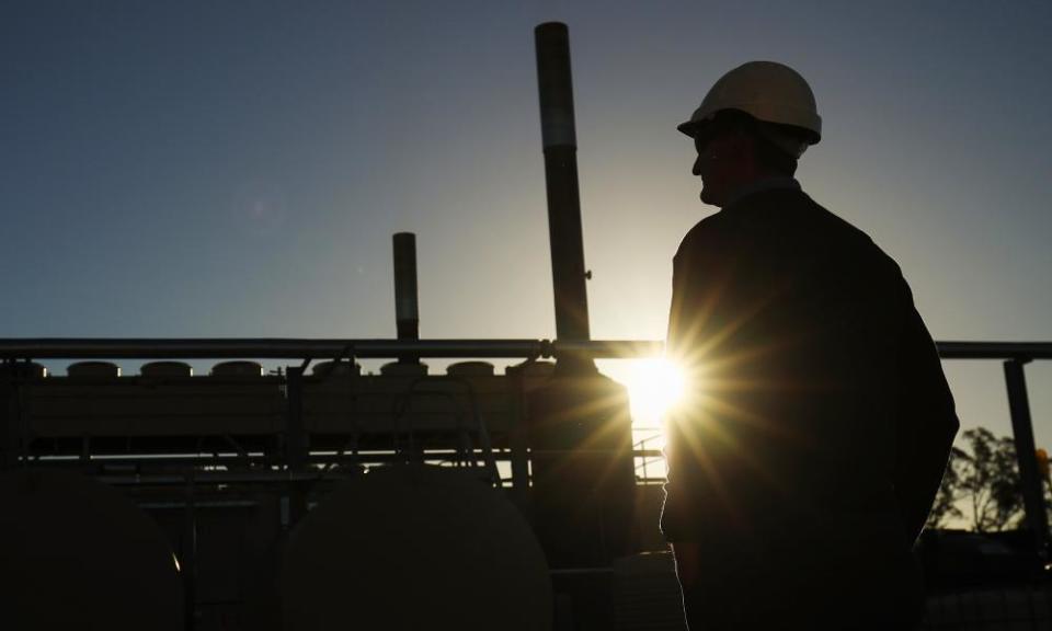 A worker looks over a coal seam gas project in Narrabri.