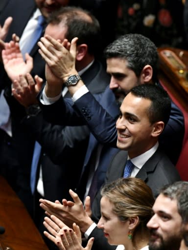 Five Stars Mouvement (M5S) leader Luigi Di Maio (centre) and M5S deputies applaud in parliament shortly after the March election
