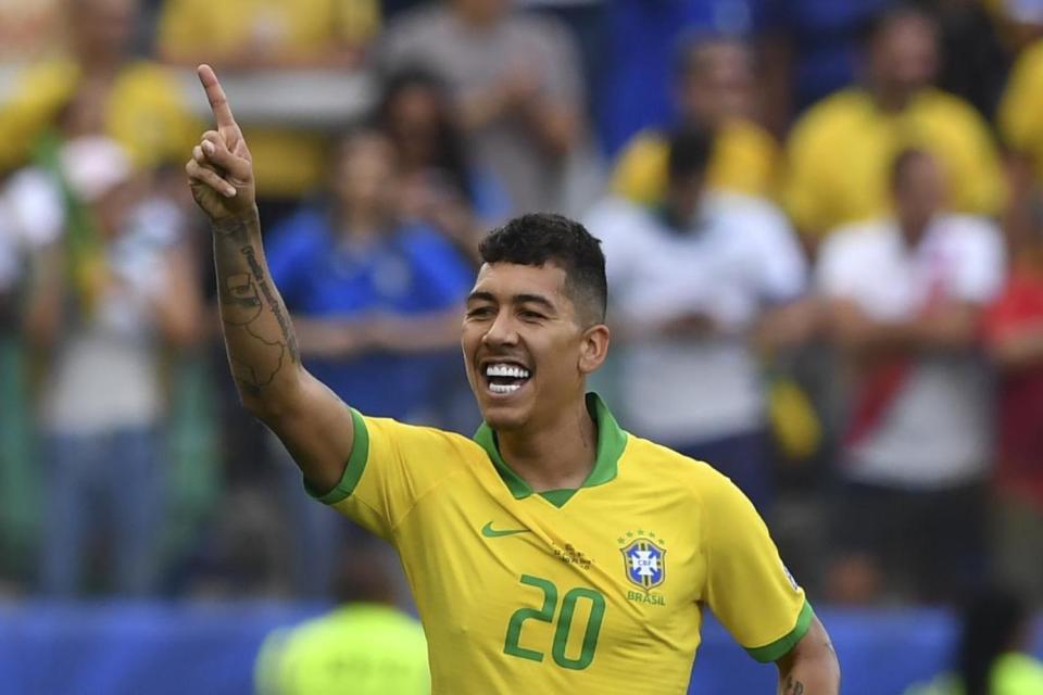 Firmino celebrates scoring for Brazil: Getty