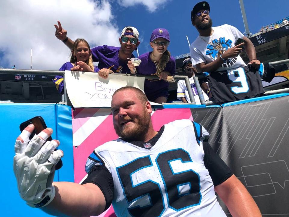 Carolina Panthers center Bradley Bozeman takes a selfie with fans prior to the team’s game against the Minnesota Vikings on Sunday, October 1, 2023 at Bank of America Stadium in Charlotte, NC. Jeff Siner/jsiner@charlotteobserver.com