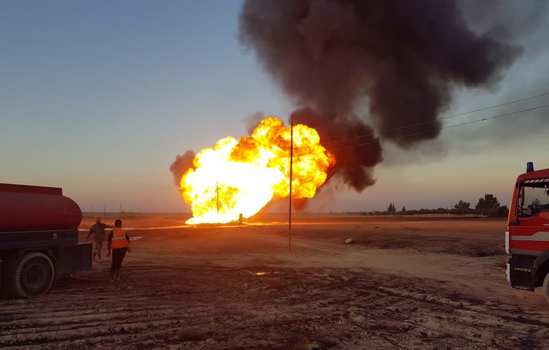 Fire and plumes of smoke are seen from an explosion on the Arab Gas Pipeline between the towns of Ad Dumayr and Adra, northwest of the capital of Damascus